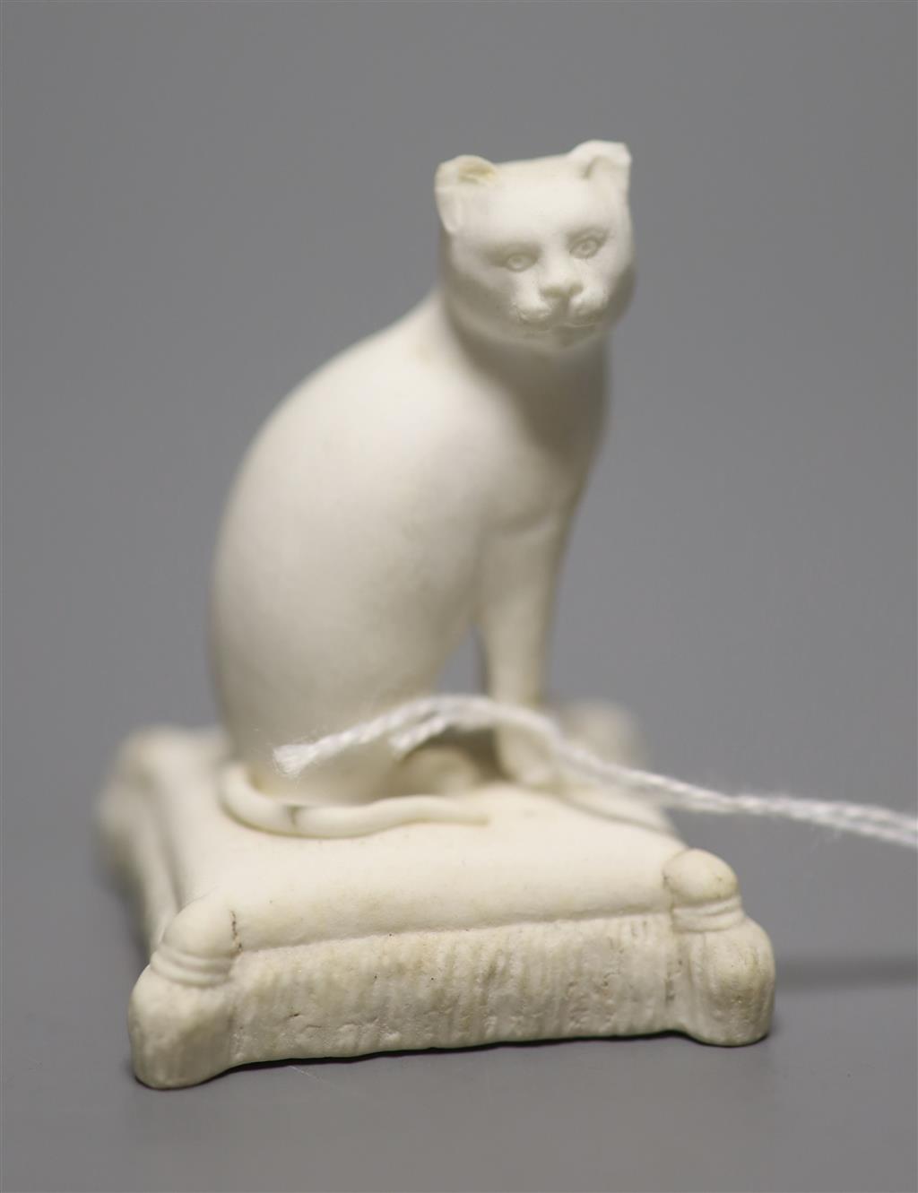 A Rockingham biscuit porcelain seated cat, c.1830, height 5cm